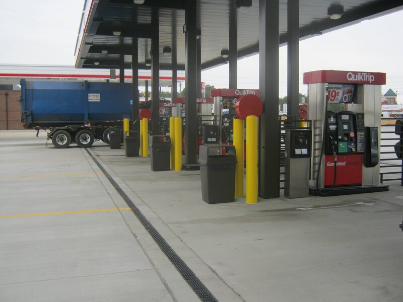 ACO PowerDrain S100K trench drain across a fuel station court
