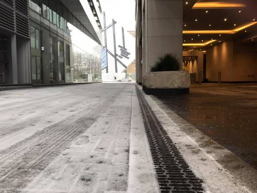 ACO PowerDrain S200K channel drain at a commercial plaza entrance
