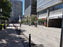 ACO PowerDrain S200K trench drain along an urban pedestrian streetscape
