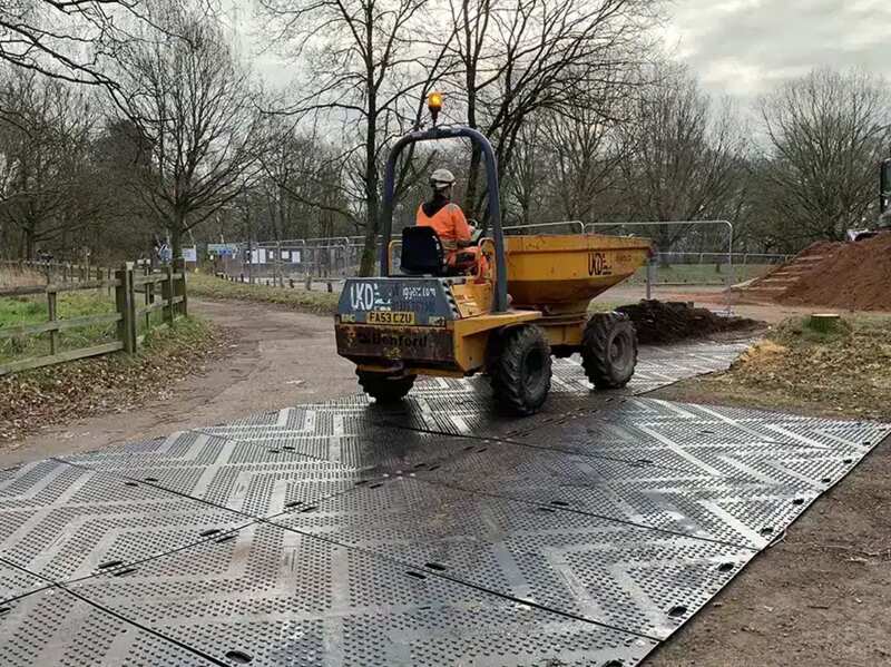 Black Blue Gator ground protection mats at a jobsite
