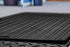 Close-up of the traction tread surface on a Blue Gator ground protection mat
