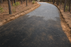 Geotextile fabric base layer on a curved gravel driveway
