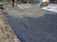 Non-woven geotextile fabric under the base layer of a paver patio installation
