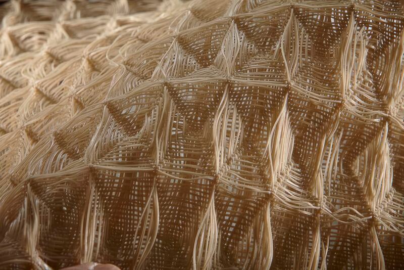Close-up of tan Propex Pyramat 75 high performance turf reinforcement mat weave
