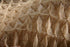 Close-up of tan Propex Pyramat 75 high performance turf reinforcement mat weave
