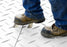 Walking on a Blue Gator HDPE ground protection mat
