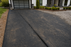 Woven geotextile driveway fabric at a two-car garage home
