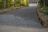 Woven geotextile fabric under gravel on a residential driveway
